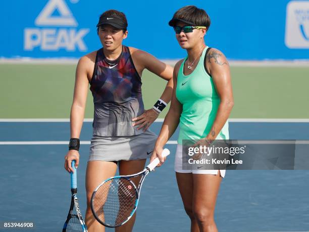 Chia-Jung Chuang of Taipei and Chen Liang of China talks to umpire during the match between Chia-Jung Chuang of Taipei and Chen Liang of China and...