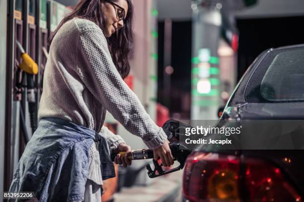 my car needs gasoline - filling petrol stock pictures, royalty-free photos & images