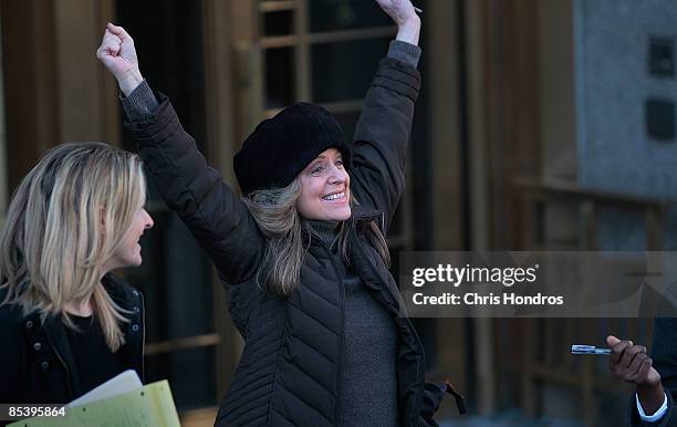 Investment victim Marian Siegman exults outside of a Manhattan Federal court after disgraced financier Bernard Madoff was sent by a judge to jail to...