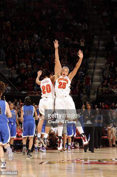 Marissa Coleman and Kristi Toliver of the Maryland Terrapins celebrate after scoring against the Duke Blue Devils at the Comcast Center on February...