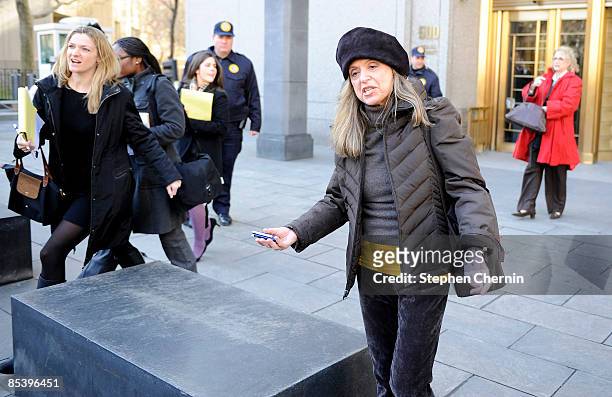 Defrauded investor Miriam Siegman leaves a Manhattan Federal courthouse after disgraced financier Bernard Madoff was sent by a judge to jail to await...