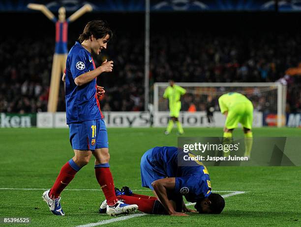 Seydou Keita of Barcelona sits on his knees celebrates scoring flanked by his teammate Bojan Krkic during the UEFA Champions League, First knock-out...