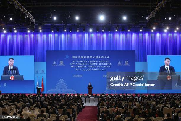 China's President Xi Jinping speaks during the 86th Interpol General Assembly at the Beijing National Convention Center in Beijing on September 26,...