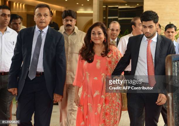 Indian industrialist and Reliance ADAG CEO Anil Ambani arrives with his wife Tina and son Anmol for the Annual General Meeting of Reliance Group...