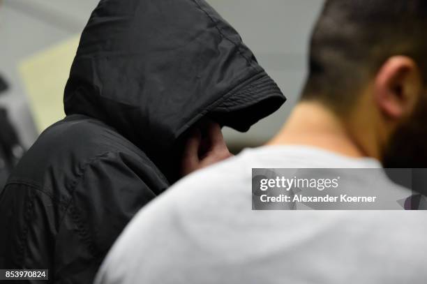 Boban S. And Mahmoud O. Arrive for the first day of his trial on terror charges at the Oberlandesgericht Celle courthouse on September 26, 2017 in...