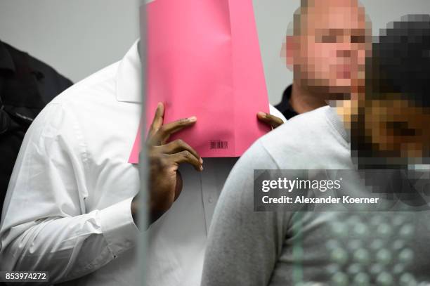 Ahmed F.Y. Arrives for the first day of his trial on terror charges at the Oberlandesgericht Celle courthouse on September 26, 2017 in Celle,...