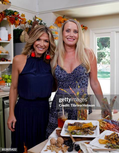 Debbie Matenopoulos and Linda Miller Nicholson pose for a photo on the set of Hallmark's 'Home and Family' at Universal Studios Hollywood on...