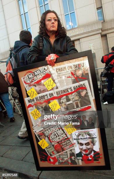 Artist Barbara Karen Dweck holds a montage of $50 billion Ponzi schemer financier Bernard outside a Manhattan Federal courthouse after Madoff was...