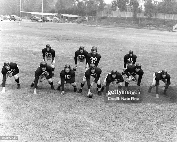 Quarterback Sammy Baugh of the Washington Redskins poses with his offensive line circa 1948 in Washington D.C.