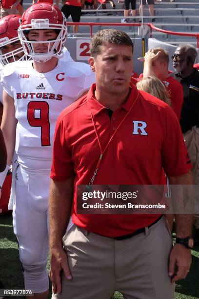 Head coach Chris Ash of the Rutgers Scarlet Knights and quarterback Kyle Bolin wait to take the field against the Nebraska Cornhuskers at Memorial...