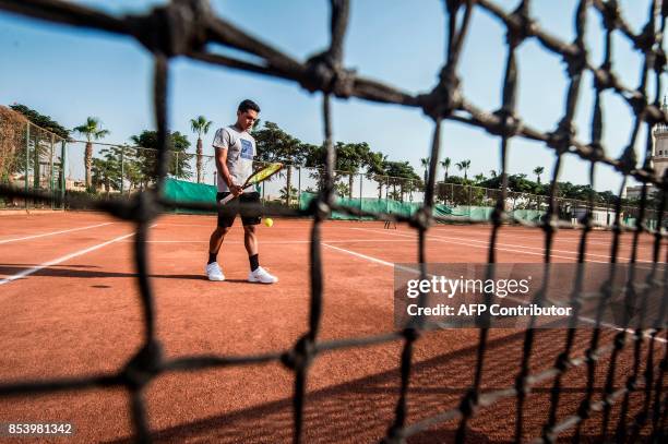 Youssef Hossam, a 19-year-old Egyptian tennis player currently holding an ATP 334 ranking, trains at a court in the capital Cairo's western suburb of...