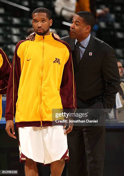 Assistant coach Vince Taylor of the Minnesota Golden Gophers talks with Damian Johnson during warm-ups against the Northwestern Wildcats during the...