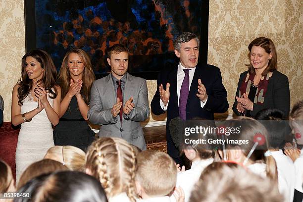 Cheryl Cole, Kimberley Walsh, Gary Barlow, Prime Minister Gordon Brown and Sarah Brown attend a meeting at number 10 Downing Street on March 12, 2009...