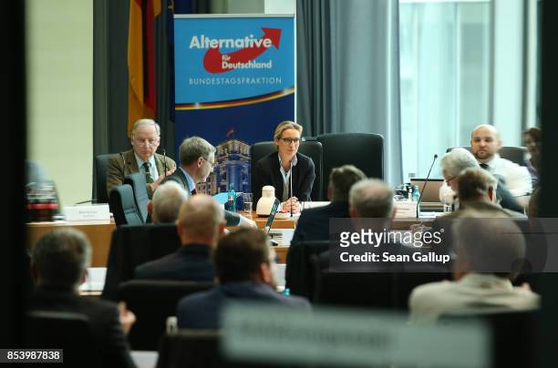In this image photographed through a glass door Alexander Gauland and Alice Weidel, who will lead the new Bundestag faction of the right-wing...