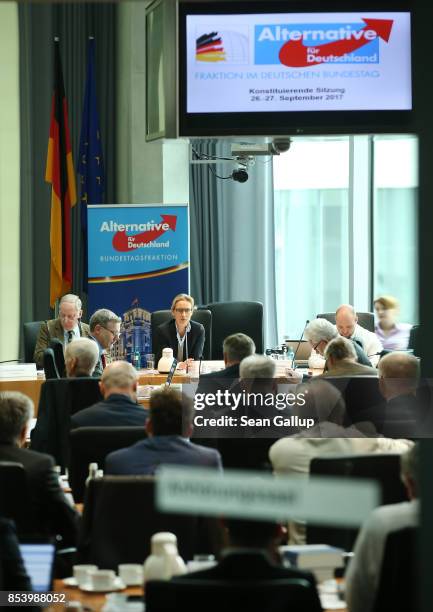 In this image photographed through a glass door Alexander Gauland and Alice Weidel, who will lead the new Bundestag faction of the right-wing...