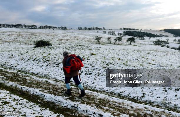 Snow on the high ground of the Yorkshire Wolds at Millington Pastures, near Pocklington, gives a walker a taste of the winter weather and snow that...