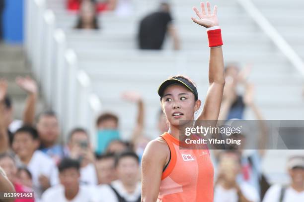 Wang Qiang of China celebrates after winning the second round Ladies Singles match against Sorana Cirstea of Romania on Day 3 of 2017 Dongfeng Motor...