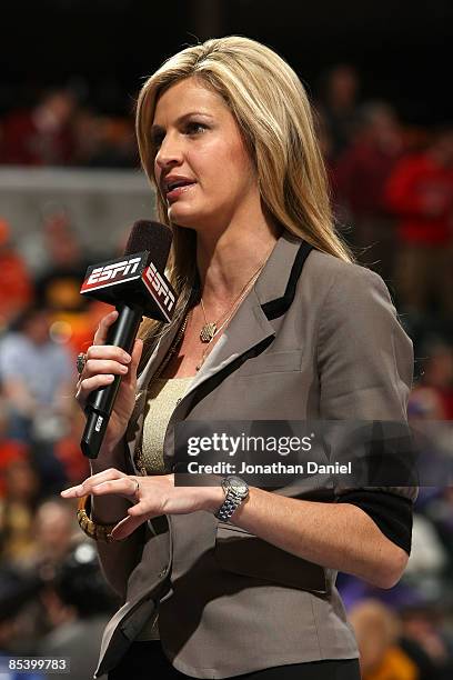 S Erin Andrews conducts an on camera report during a stop in play between the Michigan Wolverines and the Iowa Hawkeyes during the first round of the...
