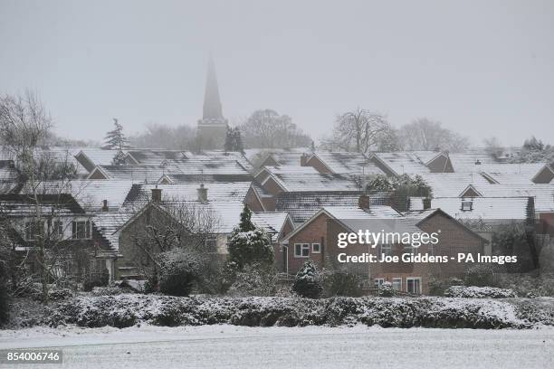 Snow covered rooftops in Houghton-on-the-Hill, Leicester, as the first wave of snow will hit most of the country and some eastern parts of Wales but...