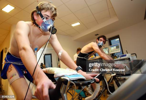 Triathlete Valentin Lenz and triathlete Niklas Bock of EJOT Buschhuetten run on a cycle during a sports performance diagnostic of triathletes at the...