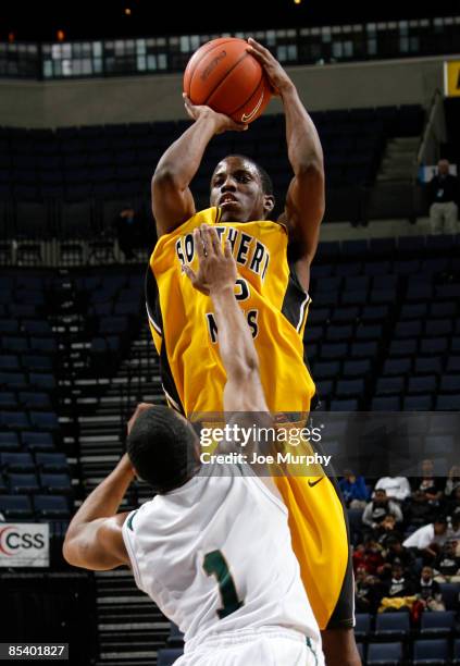 Horton of the Southern Miss Golden Eagles shoots a jumpshot over Aaron Johnson of the UAB Blazers during the Quarterfinals of the Conference USA...