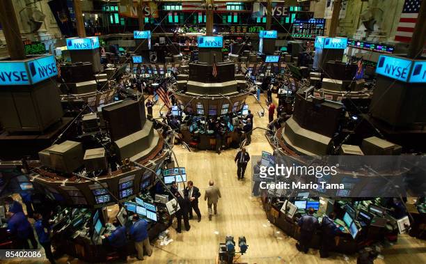 Traders work on the floor of the New York Stock Exchange March 12, 2009 in New York City. The Dow Jones climbed 240 points, bringing its rally over...