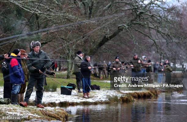 Fisherman line the banks of the river Tay at Kenmore as the salmon fishing season was declared open.