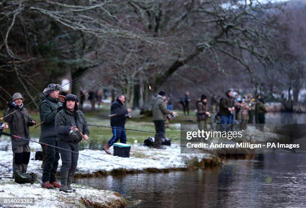 Fisherman line the banks of the river Tay at Kenmore as the salmon fishing season was declared open.