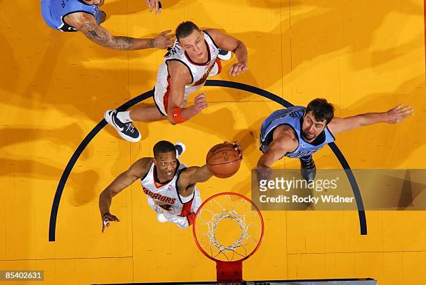 Anthony Randolph of the Golden State Warriors goes after a rebound against Mehmet Okur of the Utah Jazz during the game at Oracle Arena on March 1,...