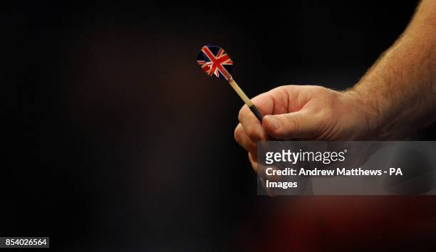 Detailed view of England's Tony O'Shea holding one of his Union Flag flighted darts