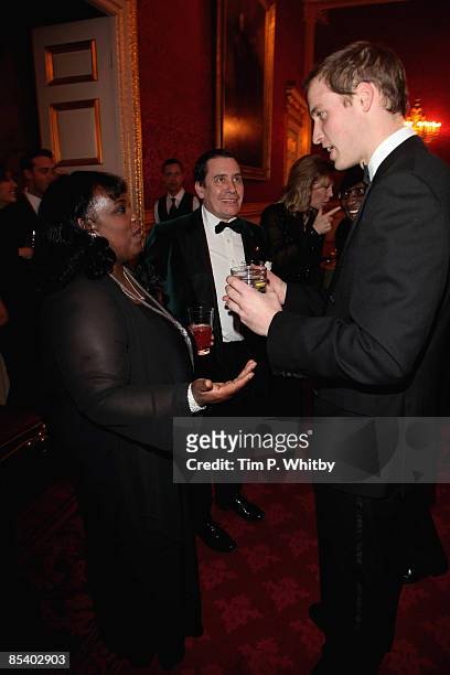 Prince William, as Patron, attends a dinner in the St James's Palace State Apartments talking Ruby Turner and Jools Holland on the occasion of the...