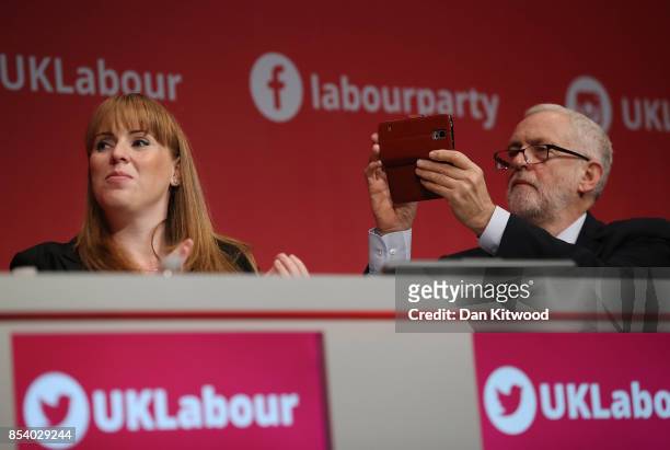 Labour Leader Jeremy Corbyn takes photographs during Shadow Secretary of State for Business, Energy and Industrial Strategy Rebecca Long-Bailey's...