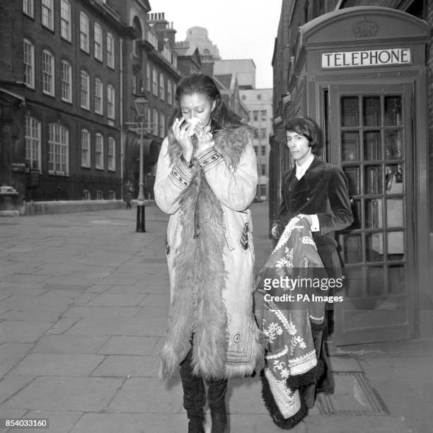 American model Donyale Luna blows her nose on a tissue while in London with American journalist Steve Brandt. Their Canadian-born actor-producer...