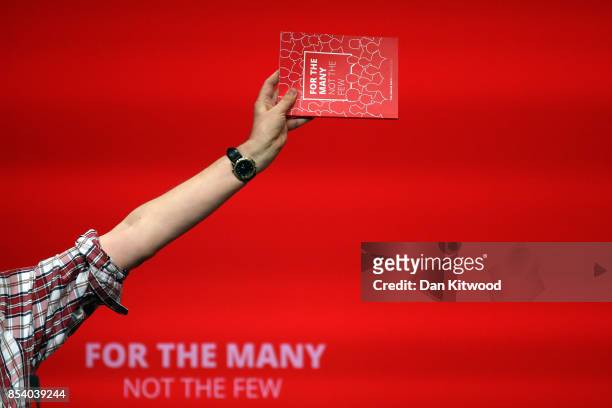 Speaker holds a manifesto aloft in the main hall, on day three of the annual Labour Party Conference on September 26, 2017 in Brighton, England.