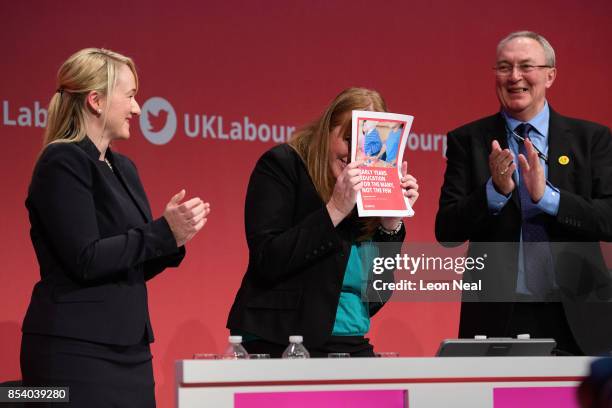 Shadow Secretary of State for Education Angela Raynor hides from applause behind the policy document that she had just launched in her speech on the...