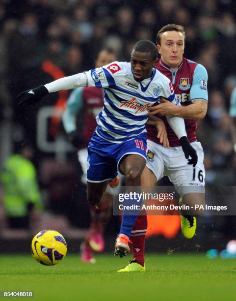 West Ham's Mark Noble and QPR's Shaun Wright-Phillips in action during the Barclays Premier League match at Upton Park, London.