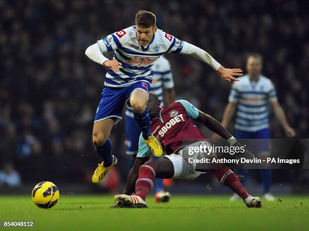 S Jamie Mackie avoids a challenge from West Ham's Mohamed Diame during the Barclays Premier League match at Upton Park, London.