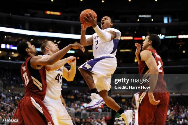 Guard Isaiah Thomas of the Washington Huskies takes a shot during their 85-73 win over the Stanford Cardinal in the Pacific Life Pac-10 Men's...