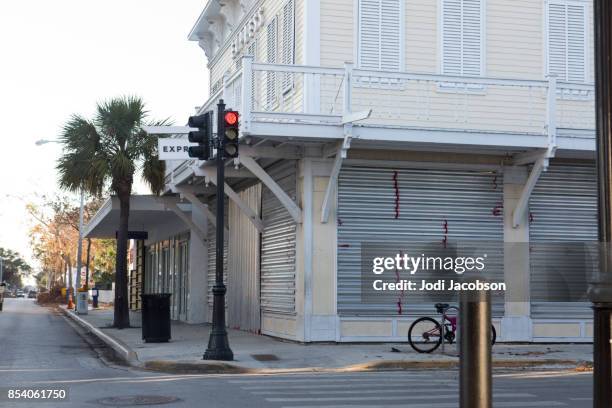 hurricane shutters were put up to protect property in key west from a hurricane - jodi west stock pictures, royalty-free photos & images