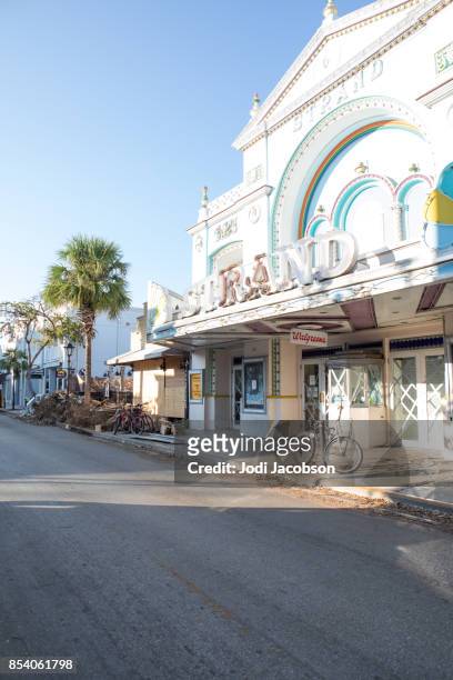 doors taped and windows boarded up with plywood in the aftermath of hurricane in key west - jodi west stock pictures, royalty-free photos & images
