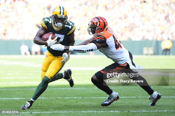 Davante Adams of the Green Bay Packers is pursued by George Iloka of the Cincinnati Bengals during a game at Lambeau Field on September 24, 2017 in...