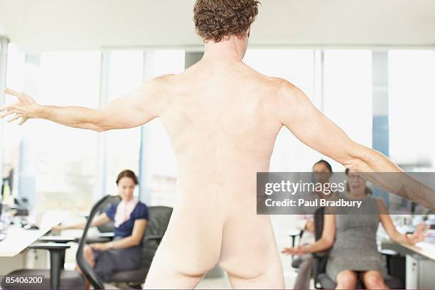 naked businessman in office - string stockfoto's en -beelden