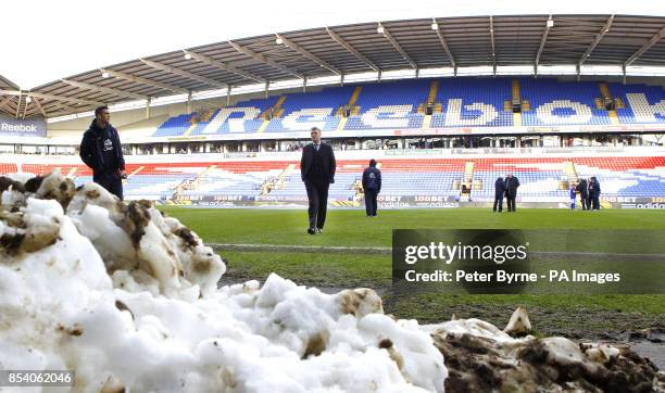 Everton Manager David Moyes assesses the pitch ahead of the FA Cup Fourth Round match at the Reebok Stadium, Bolton.