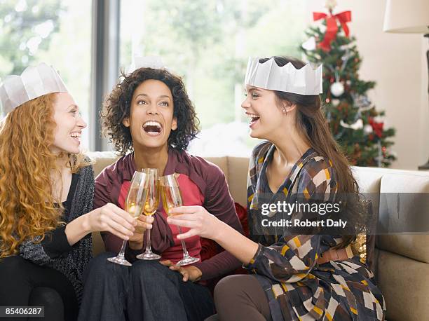 friends toasting with champagne at party - njutningslystnad bildbanksfoton och bilder