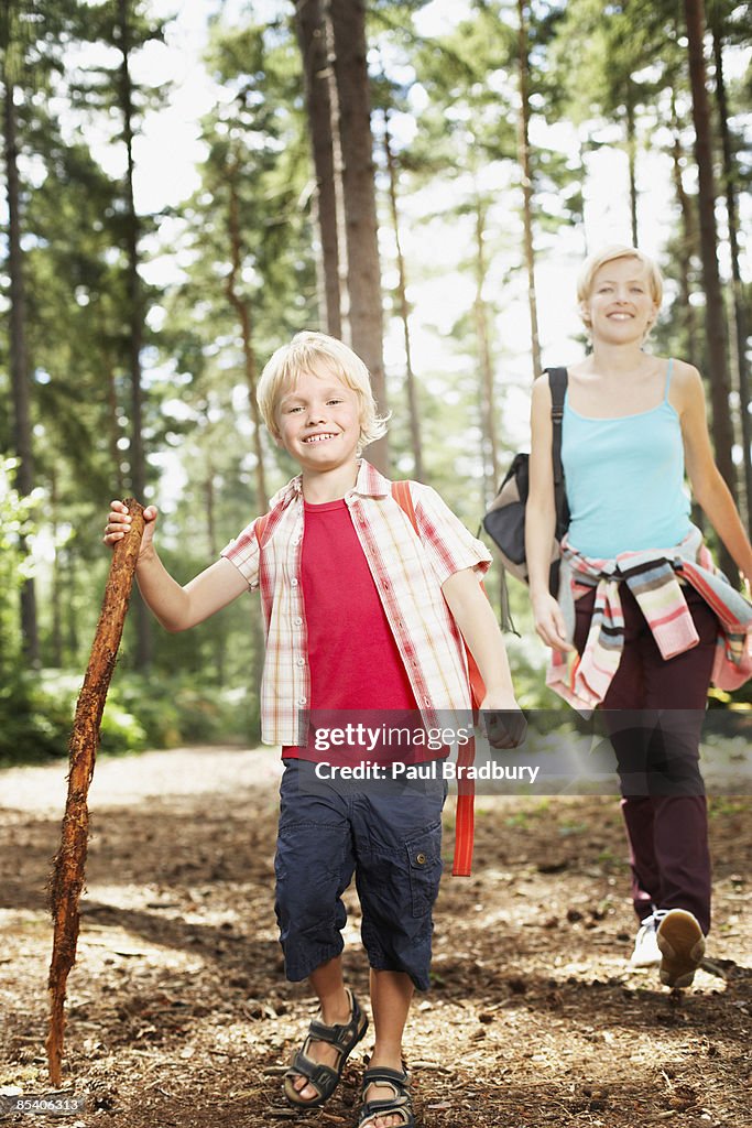 Mother and son hiking in woods