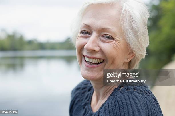 senior woman laughing - 60 woman stock pictures, royalty-free photos & images