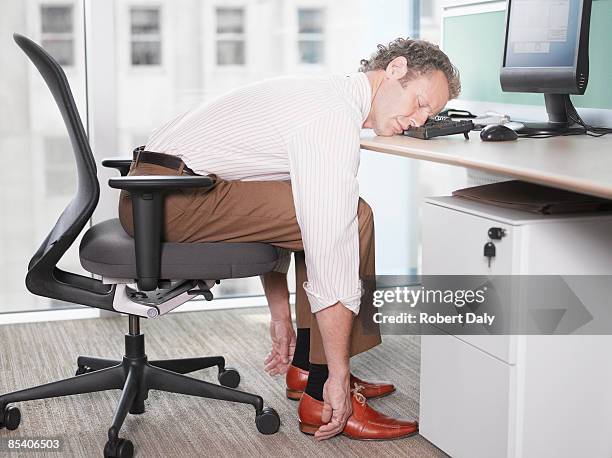 businessman sleeping on computer keyboard - procrastination stock pictures, royalty-free photos & images