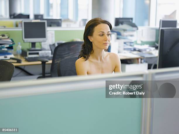 naked businesswoman working at desk - nudity stock pictures, royalty-free photos & images