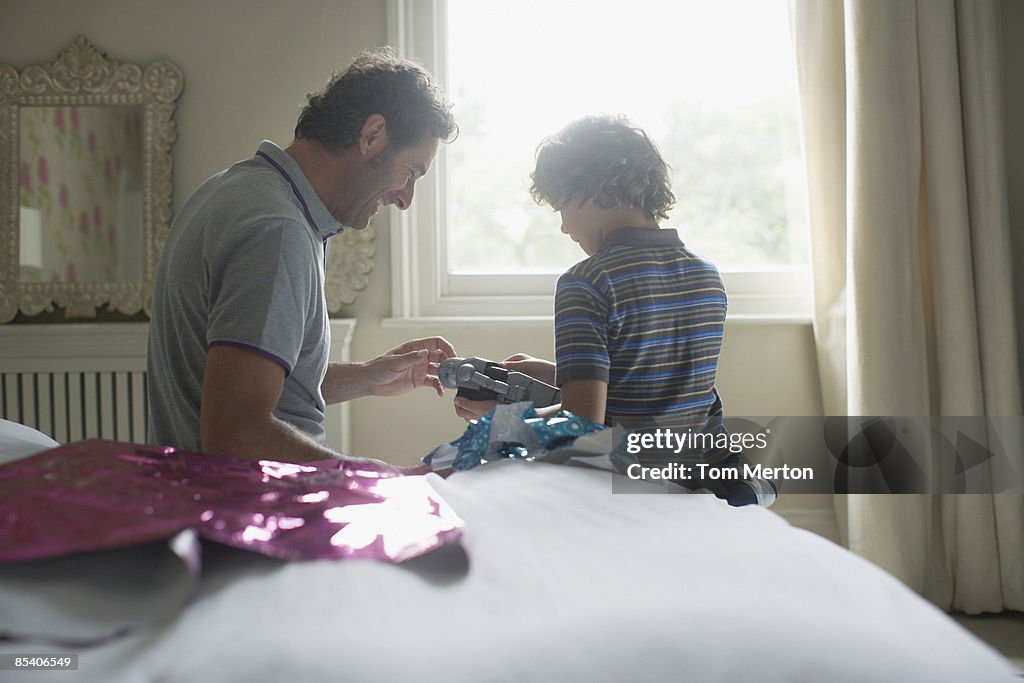 Father giving son Christmas gift