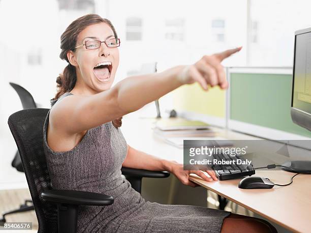 businesswoman pointing and shouting - mischief stock pictures, royalty-free photos & images